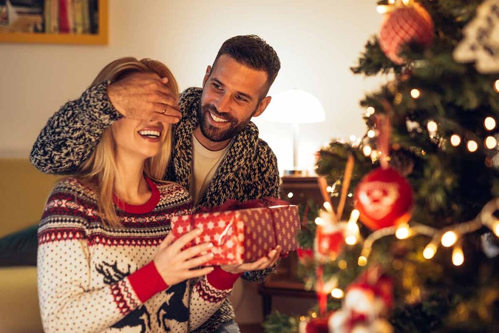 a woman and man enjoy a sober holiday season together